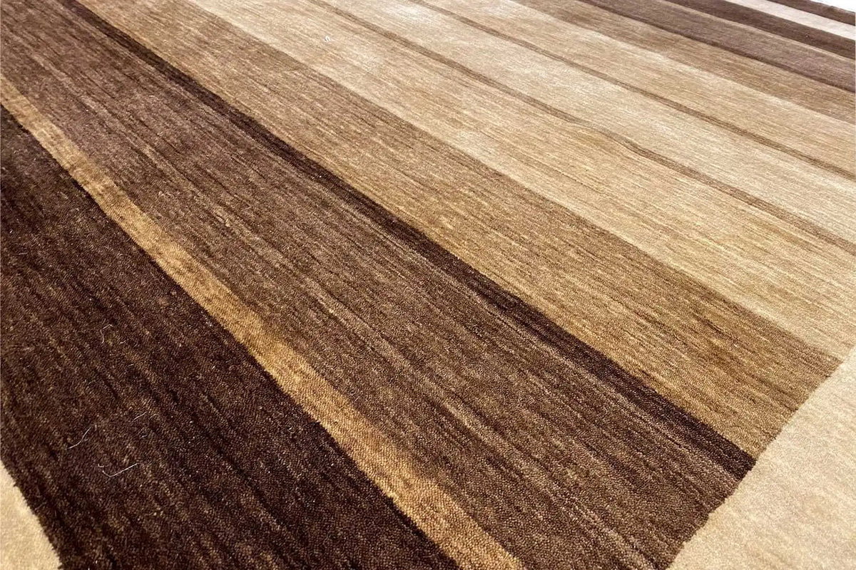 Close-up of the carpet pattern: brown and beige stripes in the pile, visible edges.