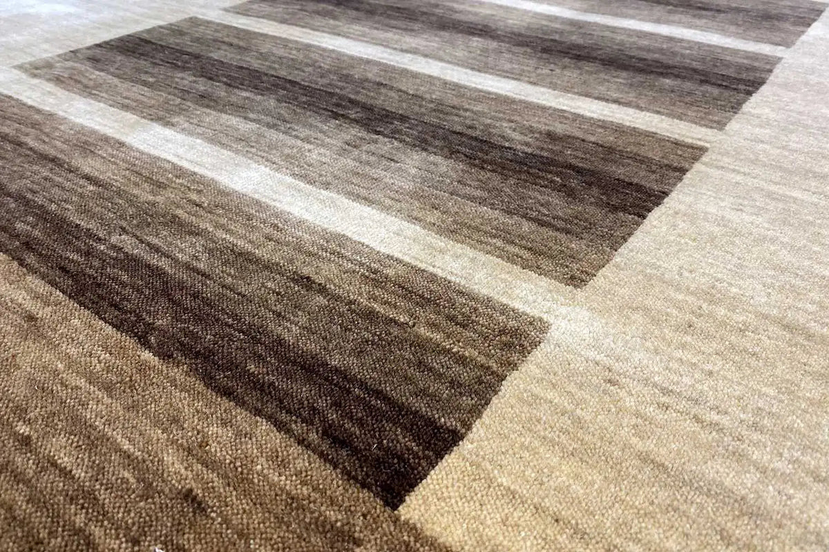 Gabbeh rug close-up: beige and brown stripes, fine texture