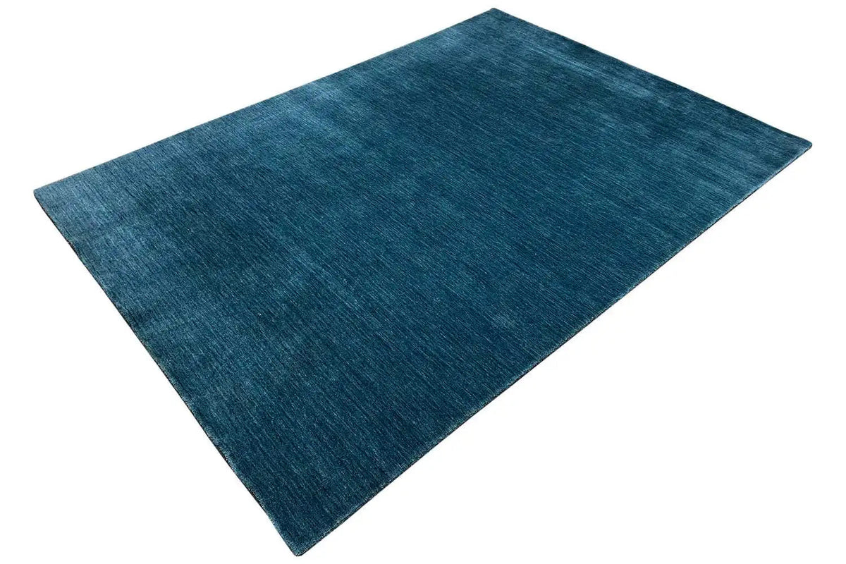 Blue Gabbeh rug, square, with a diagonal pile pattern visible