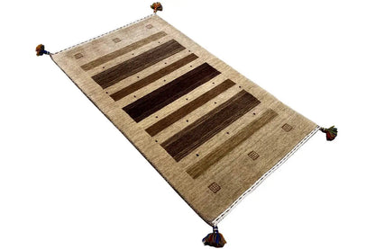 Gabbeh rug 121x72 cm, diagonal, beige background with dark brown stripes