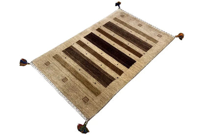 Gabbeh rug 121x72 cm, angled, beige background with brown bars and tassels