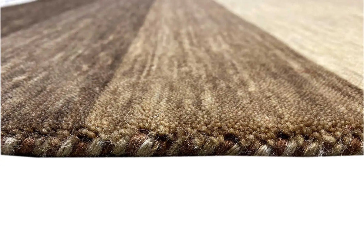 Close-up of the carpet pile with a contrasting border in brown and beige