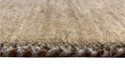Gabbeh rug close-up: dense pile with light and dark brown color transitions