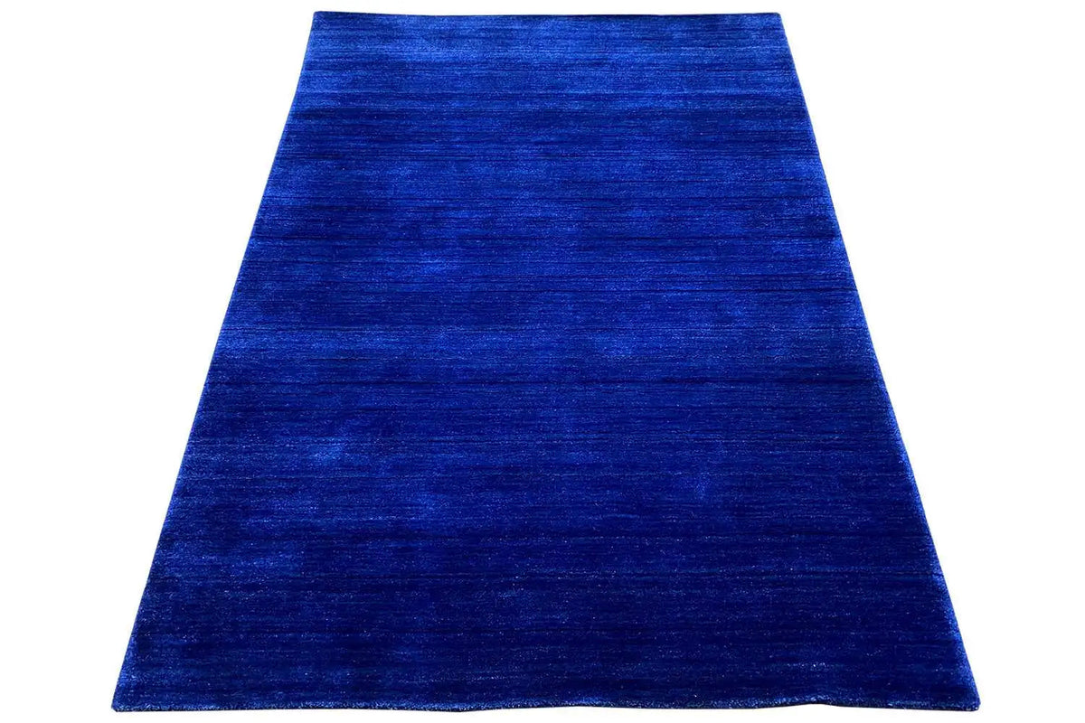 Gabbeh rug made of woven fabric, 176x123 cm, dark blue, spread out in a trapezoidal shape
