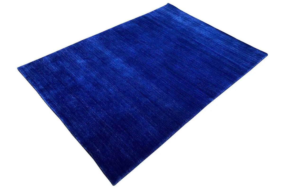 Gabbeh rug made of woven fabric, 176x123 cm, dark blue, photographed at a slight angle