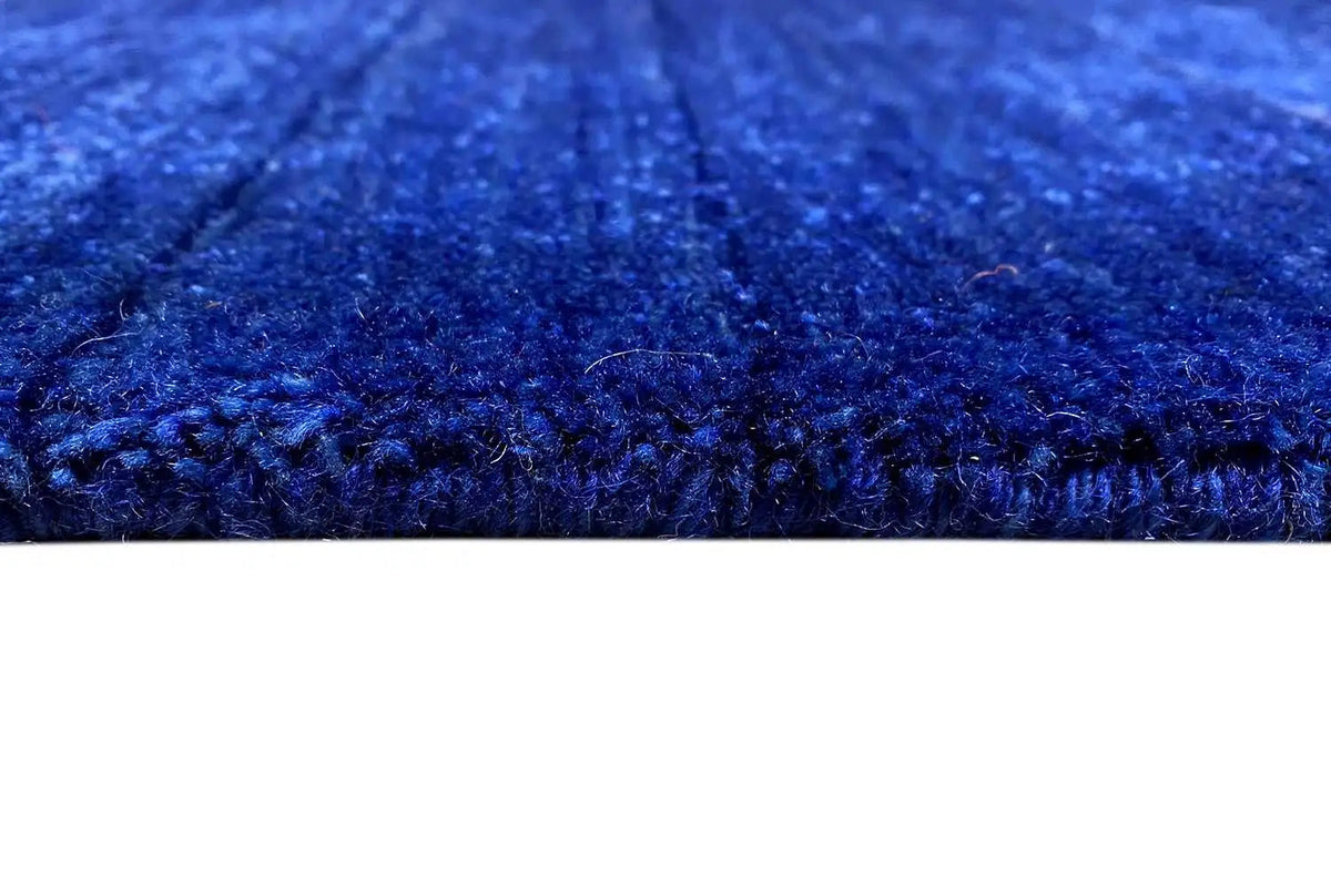 Gabbeh rug made of woven fabric, 176x123 cm, close-up: dark blue pile texture