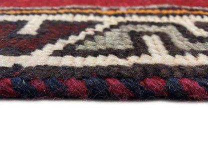 Gabbeh-Lori rug: multicolored woven border with fringes, detail of the pattern structure