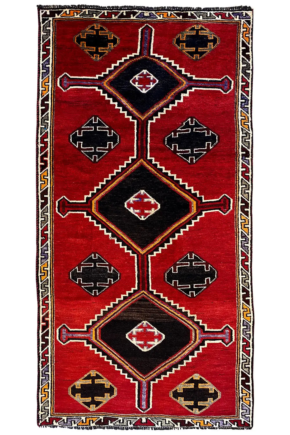 Gabbeh Lori rug with a geometric diamond pattern, red background, multicolored border