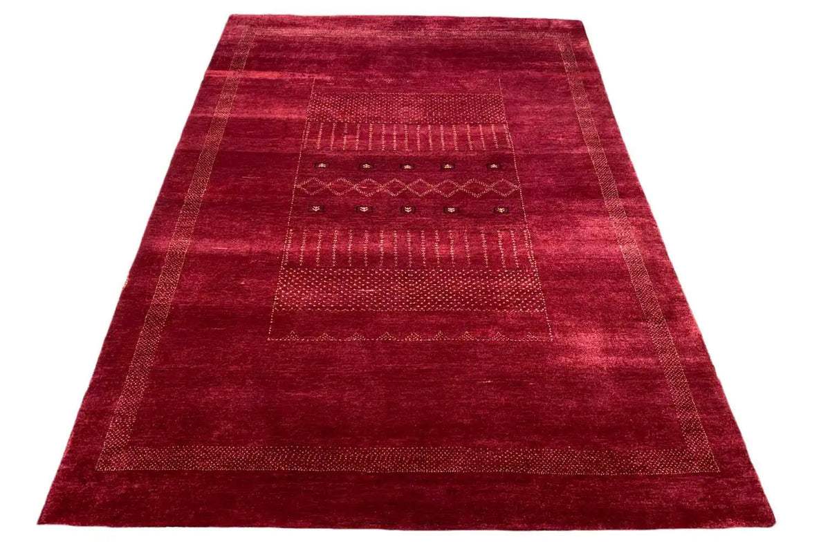 Gabbeh Lori rug in dark red with geometric panels and decorative borders