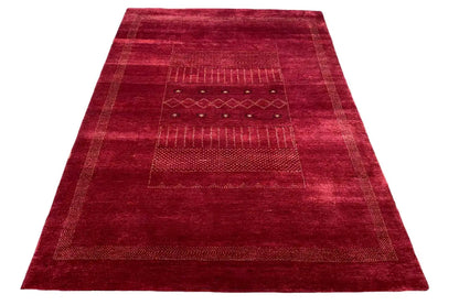 Gabbeh Lori rug in dark red with geometric panels and decorative borders