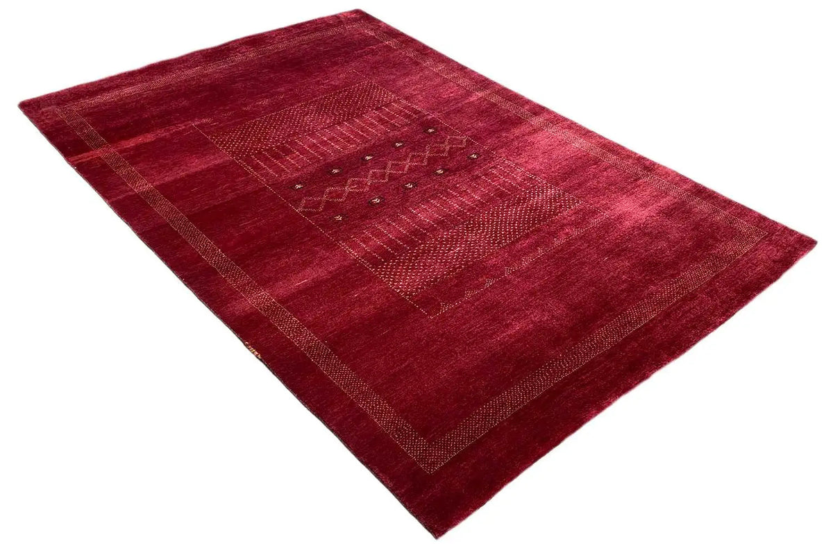 Lori Gabbeh rug in red, diagonal pattern with surrounding decorative border