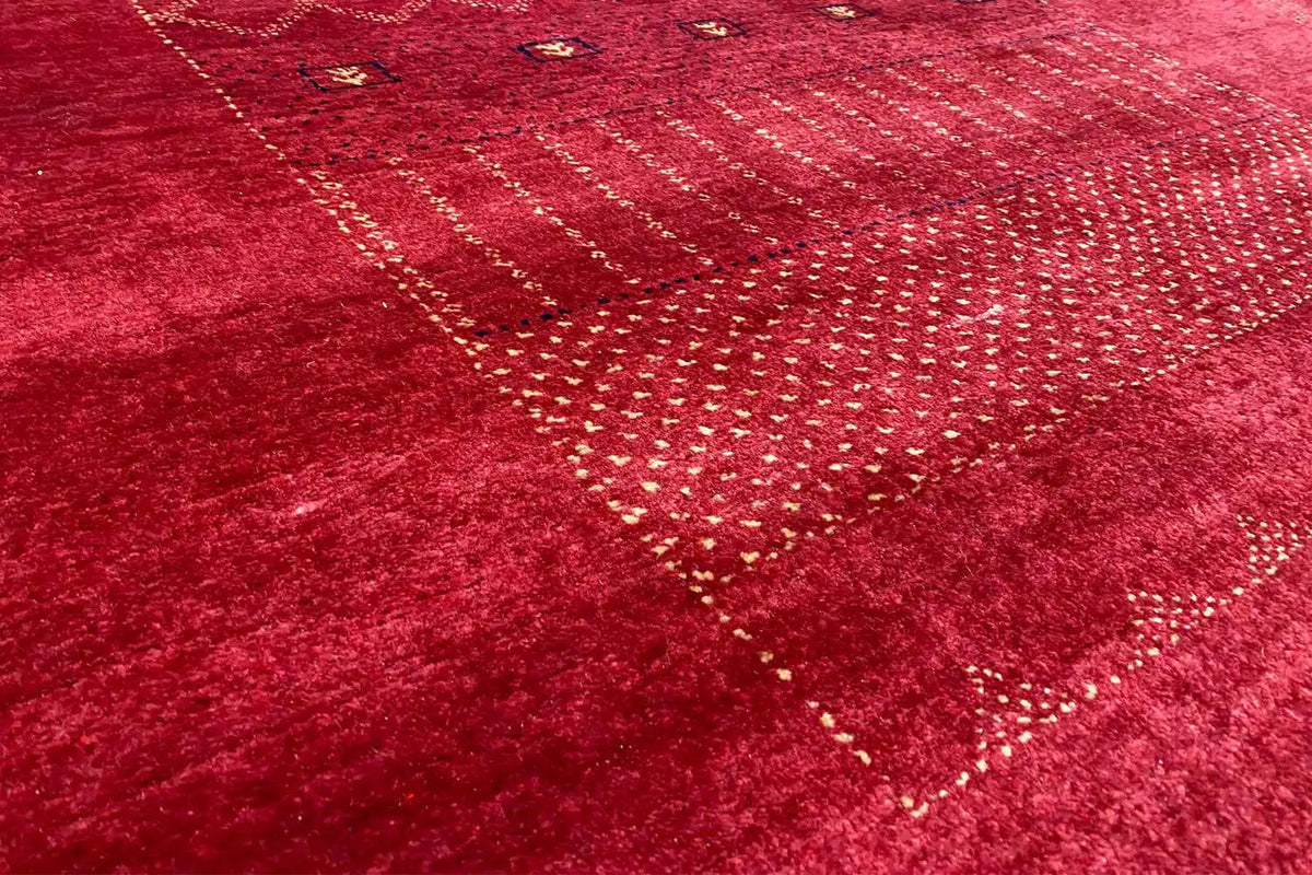 Lori Gabbeh rug: red all-over pattern with dot, line, and zigzag ornaments