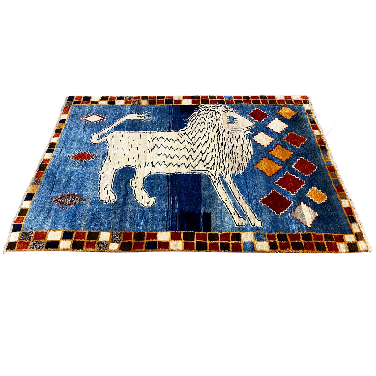 Blue Gabbeh rug with a white lion and blue ornamental field, narrow diamond-pattern border.