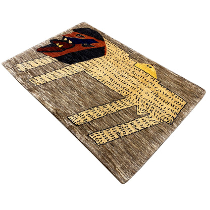 Gabbeh rug with a lion motif and graphic patterns in brown, beige, and yellow