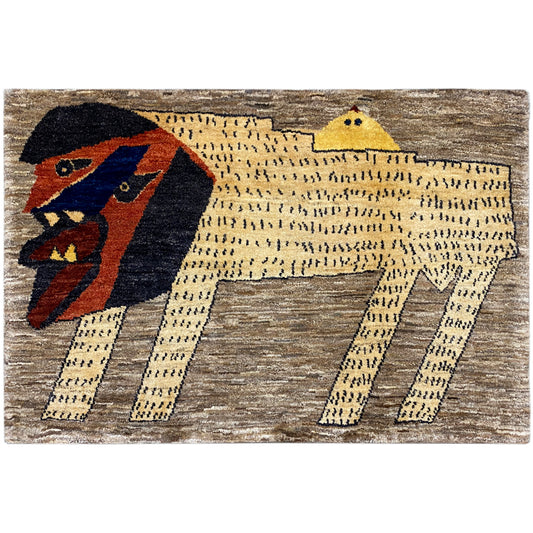 Gabbeh rug with a stylized lion motif in brown, beige, yellow, blue, and red