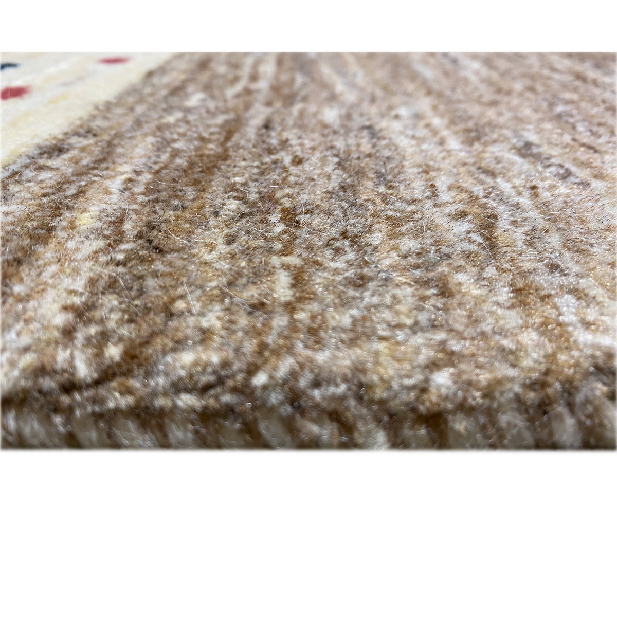 Close-up of a Gabbeh rug with brown-mottled pile and an even texture