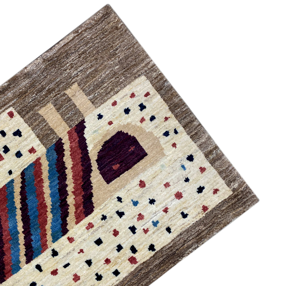 Gabbeh rug detail: brown border with a cream-colored field, square motif, and stripes