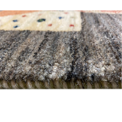 Gabbeh rug weave detail with dense pile and a light-colored edge