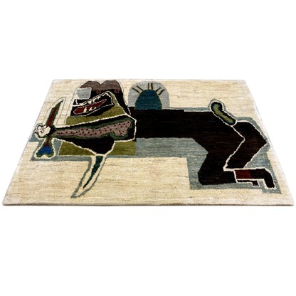 Rectangular Gabbeh rug with a beige background and a large figurative design in green, blue, and black
