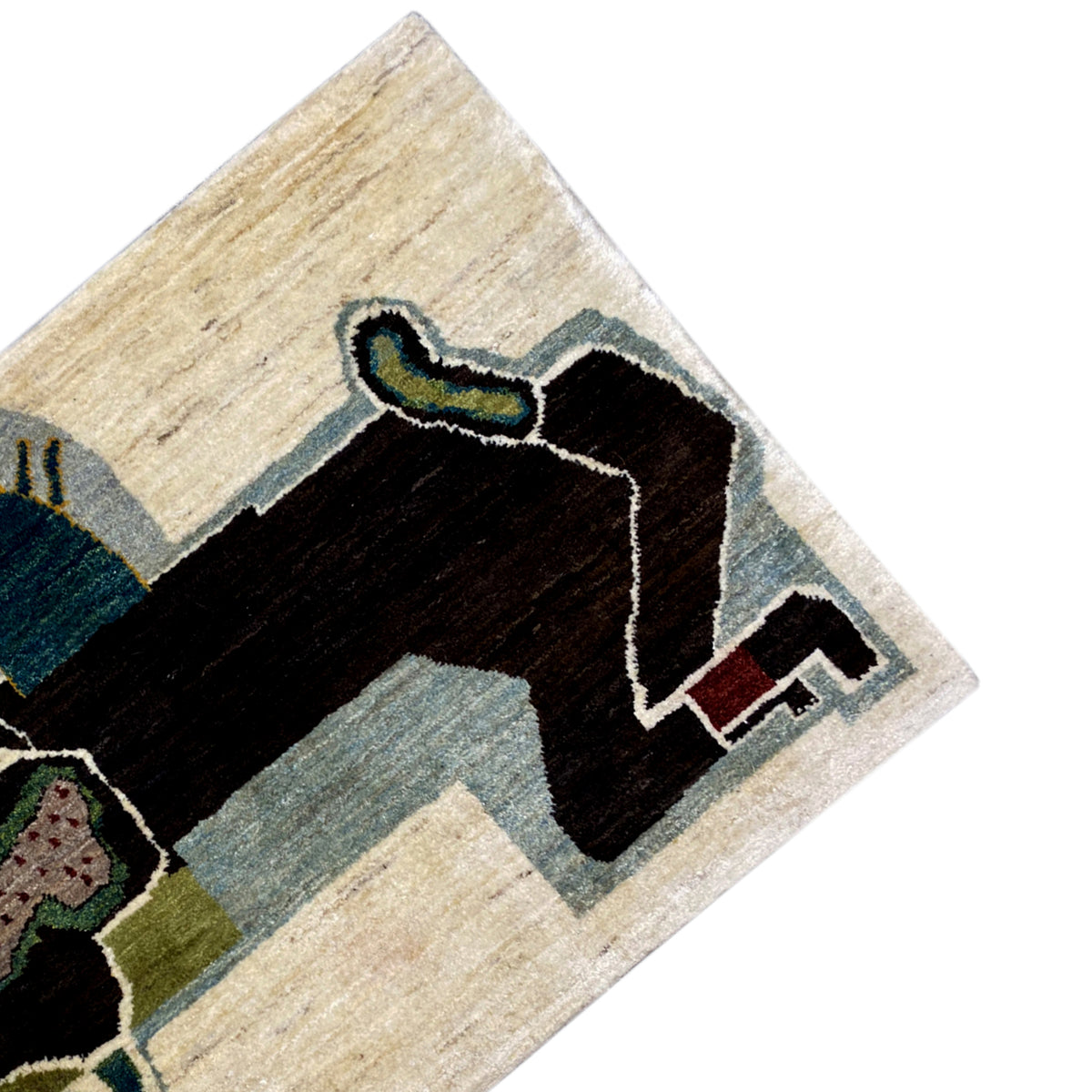 Corner of the Gabbeh rug with a black figure, light blue accent, and beige border