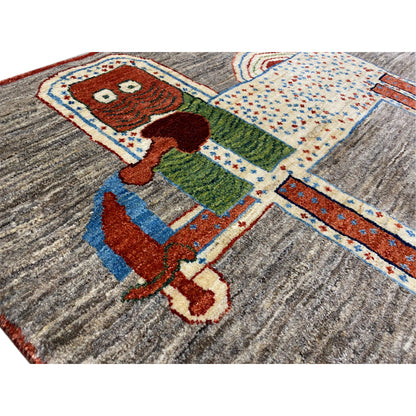 Lion gabbeh rug 117x79 cm close-up: colorful animal motif on gray fabric
