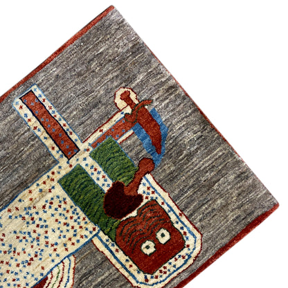 Lion Gabbeh rug 117x79 cm, corner view with a colorful animal motif and decorative border