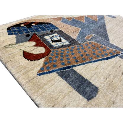 Gabbeh rug detail view: blue square, beige pile, brown and red accents