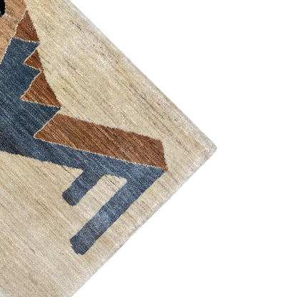 Gabbeh rug corner with a beige background and blue-gray lines, brown triangles