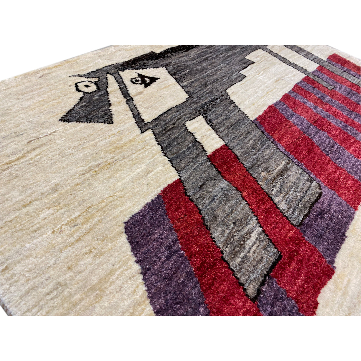 Beige Gabbeh rug, detail with patterned stripes in black, red, gray, and purple