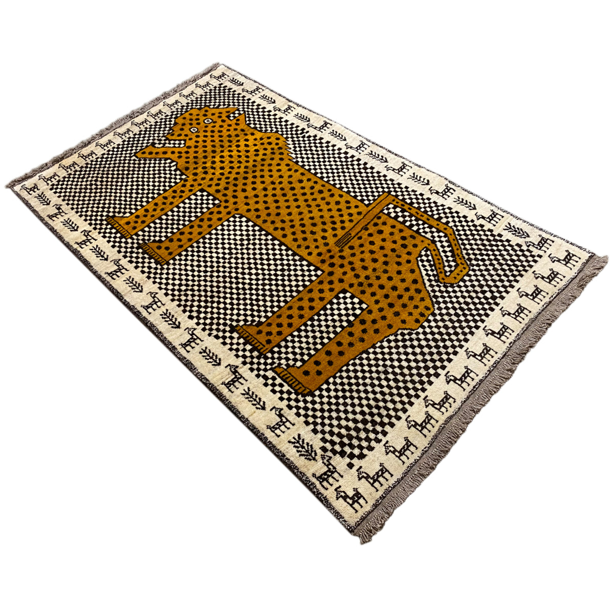 Gabbeh rug with a yellow leopard motif and spotted pattern, framed on both sides, with fringes