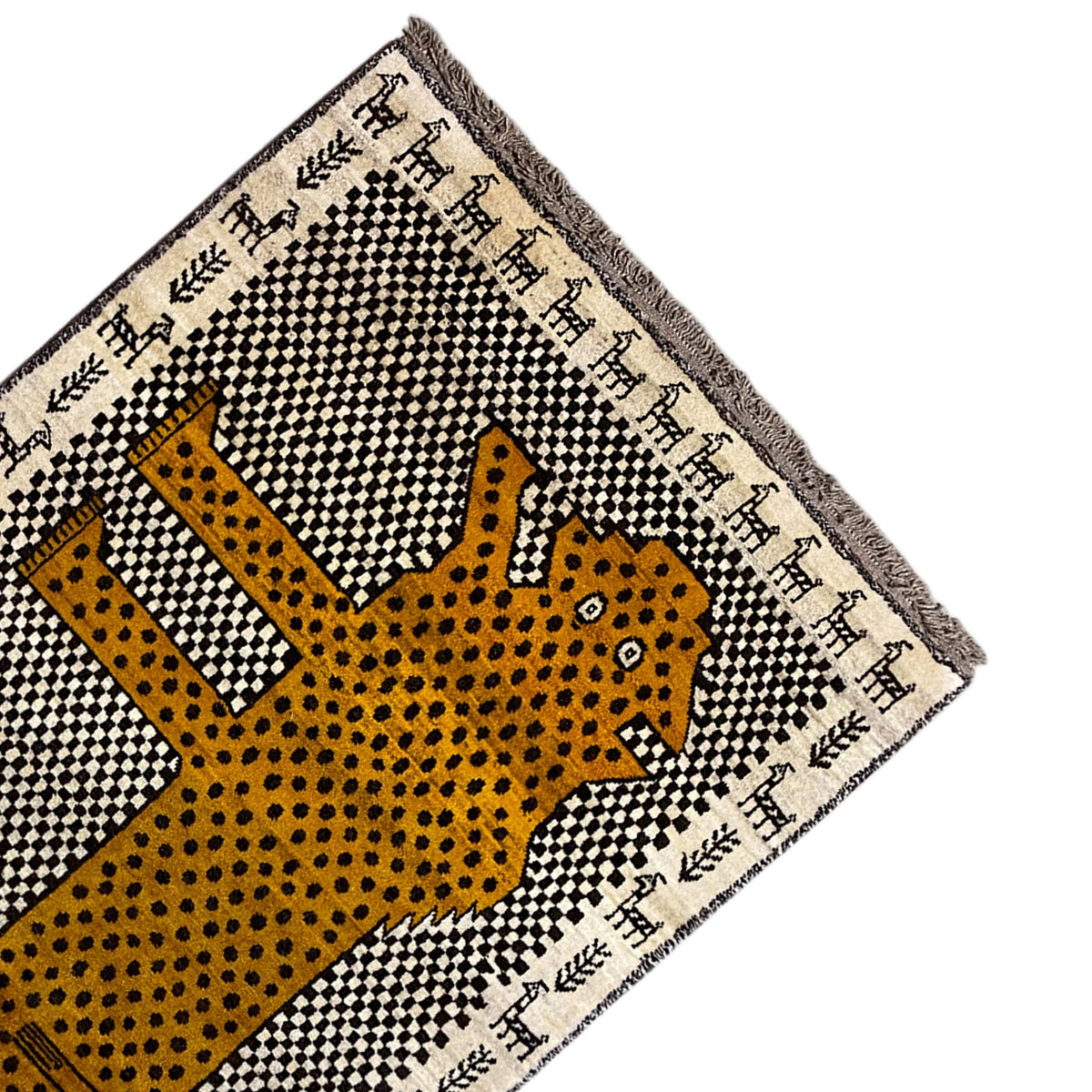 Gabbeh rug corner with leopard motif in yellow, black-and-white checkered grid, and fringe
