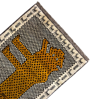 Gabbeh rug corner with leopard motif in yellow, black-and-white checkered grid, and fringe