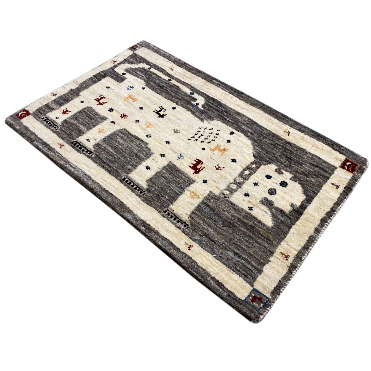 Gabbeh rug 89x60 cm viewed at an angle, dark fields, light borders, and small embellishments