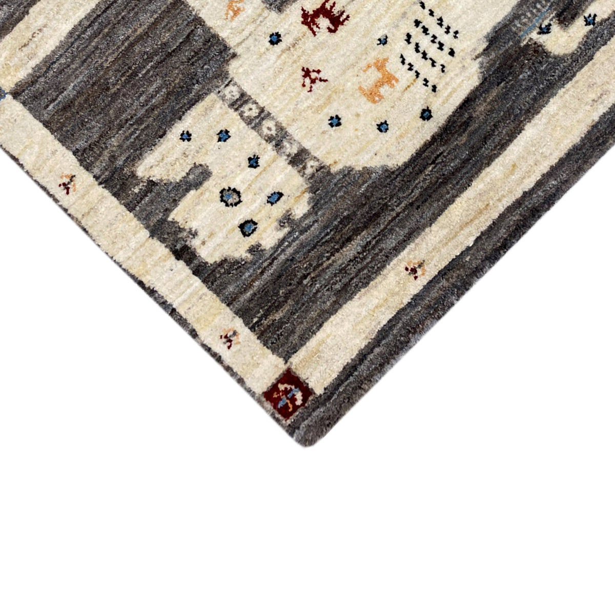 Gabbeh rug close-up with lion motifs, cream and dark gray