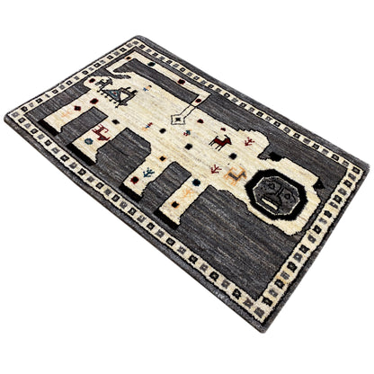 Gabbeh rug in gray/ecru with a geometric pattern and ornate border trim