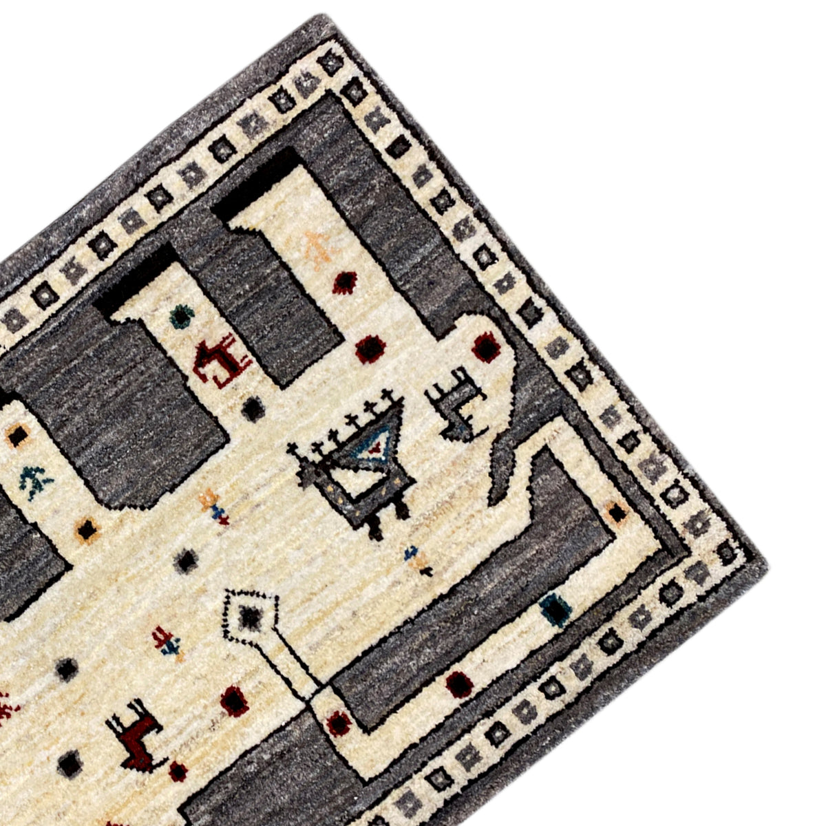 Gabbeh rug corner with decorative border, cream-colored background, and gray rectangles