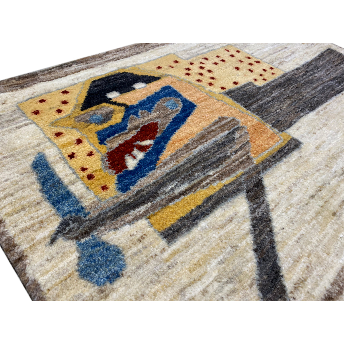 Close-up of the carpet pattern: vehicle motif with dots, blue, red and yellow on beige