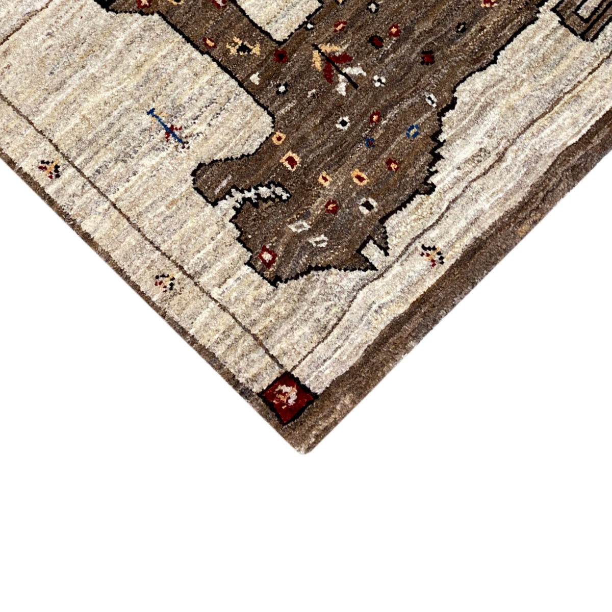 Corner of the brown Gabbeh rug with a lion motif, detailed view of the edge
