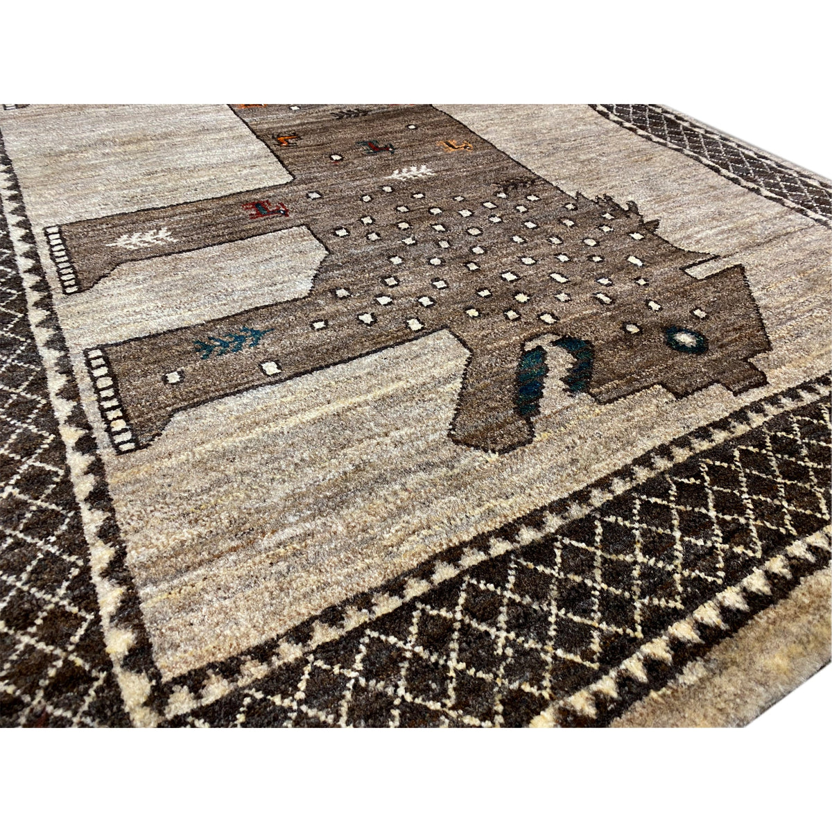 Lion Gabbeh rug 170x110 cm close-up, beige, dark brown, and white dots