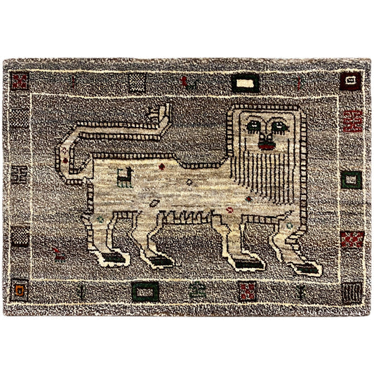 Gray Gabbeh rug with a geometric pattern and red/green accents, rectangular