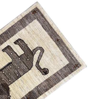 Gabbeh rug corner with lion motif: beige patterned field and gray-brown border stripes.