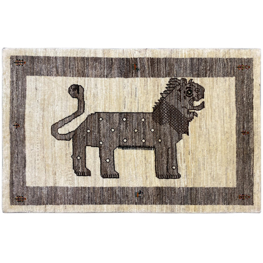 Beige Gabbeh rug with a lion motif in gray and brown tones, rectangular with a finished edge.