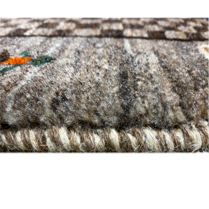 Texture view of the beige Gabbeh rug with pile and bound rug edge