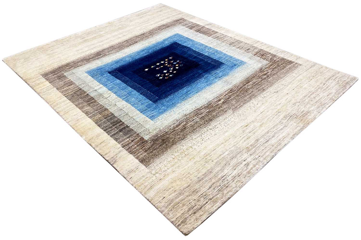 Diamond-shaped oriental rug, cream and brown with a blue inner border and dark center