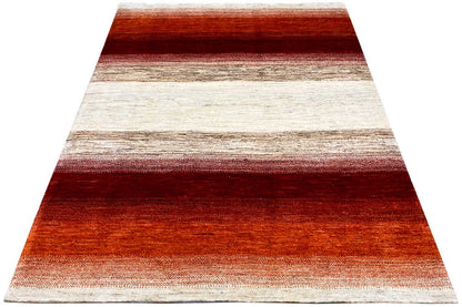 Rug in triangular view with horizontal stripes in red, terracotta, and cream