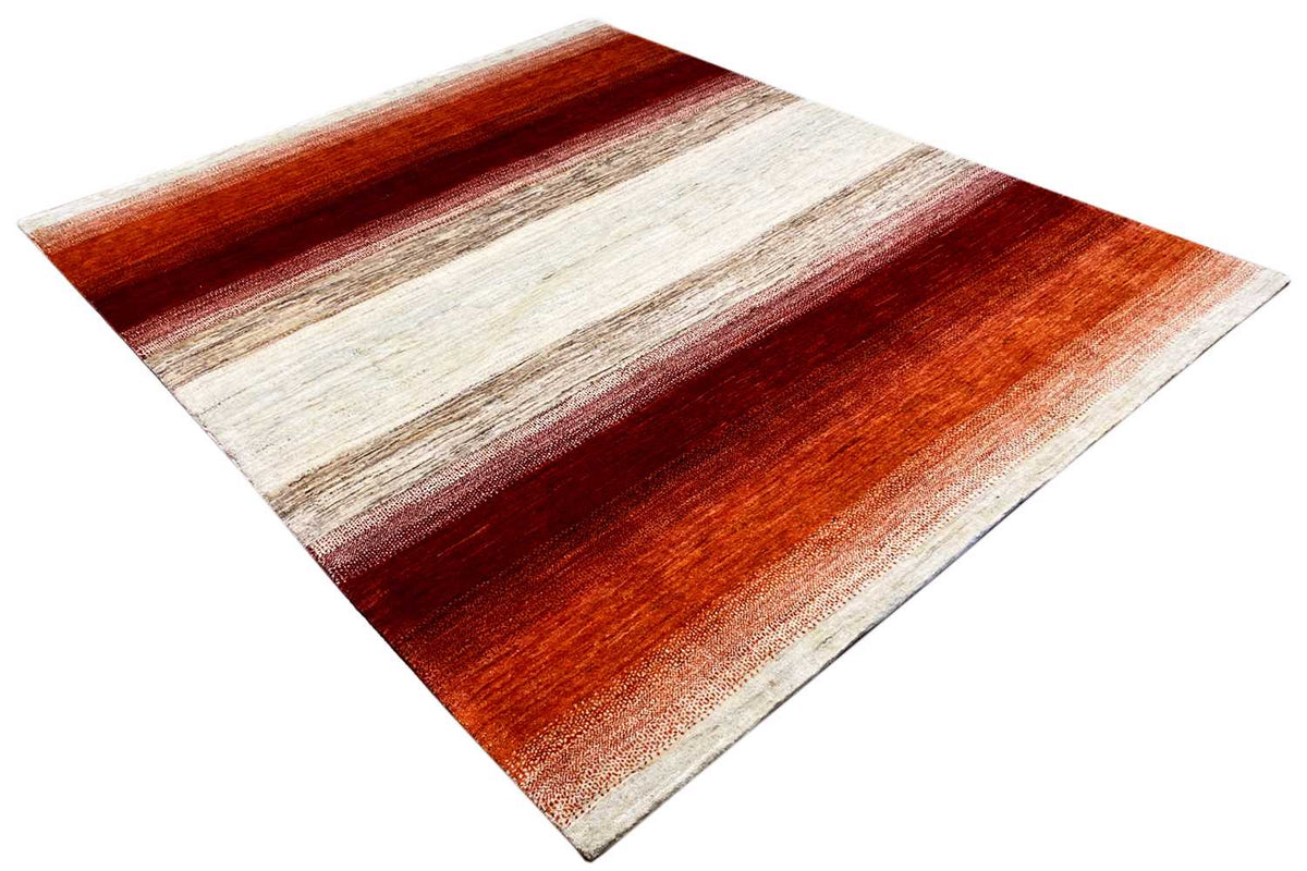 Carpet corner with a diagonal view, orange-red and cream-colored stripes