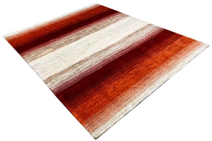 Carpet corner with a diagonal view, orange-red and cream-colored stripes
