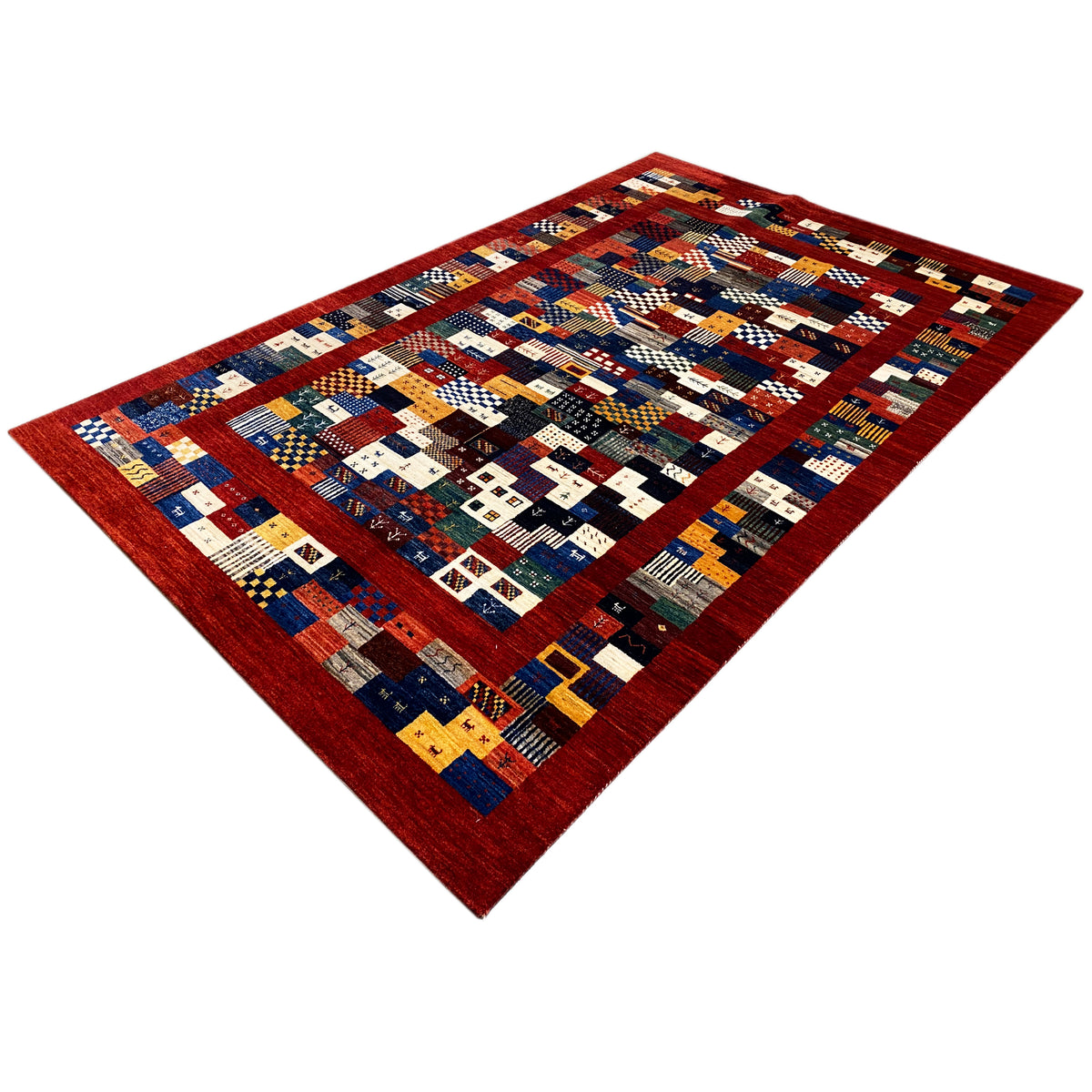 Gabbeh-Luri rug 300x194 cm, photographed diagonally, colorful patchwork with a red border