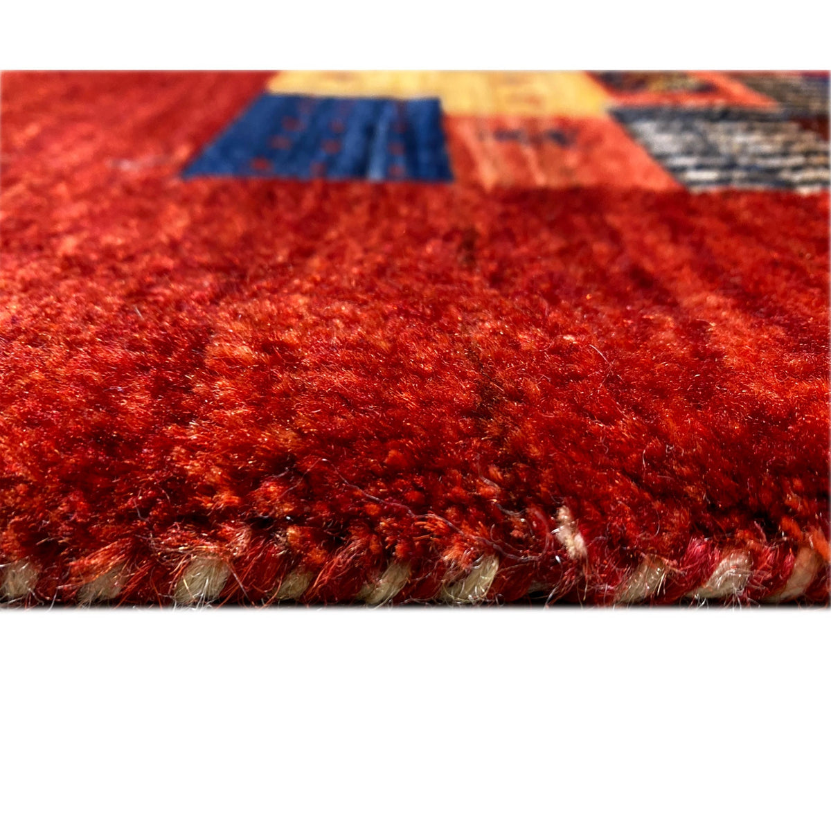 Gabbeh-Luri rug 300x194 cm close-up of the pile area, reddish fibers and rug edge