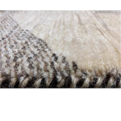 Close-up of the carpet surface with short pile in beige and dark brown areas